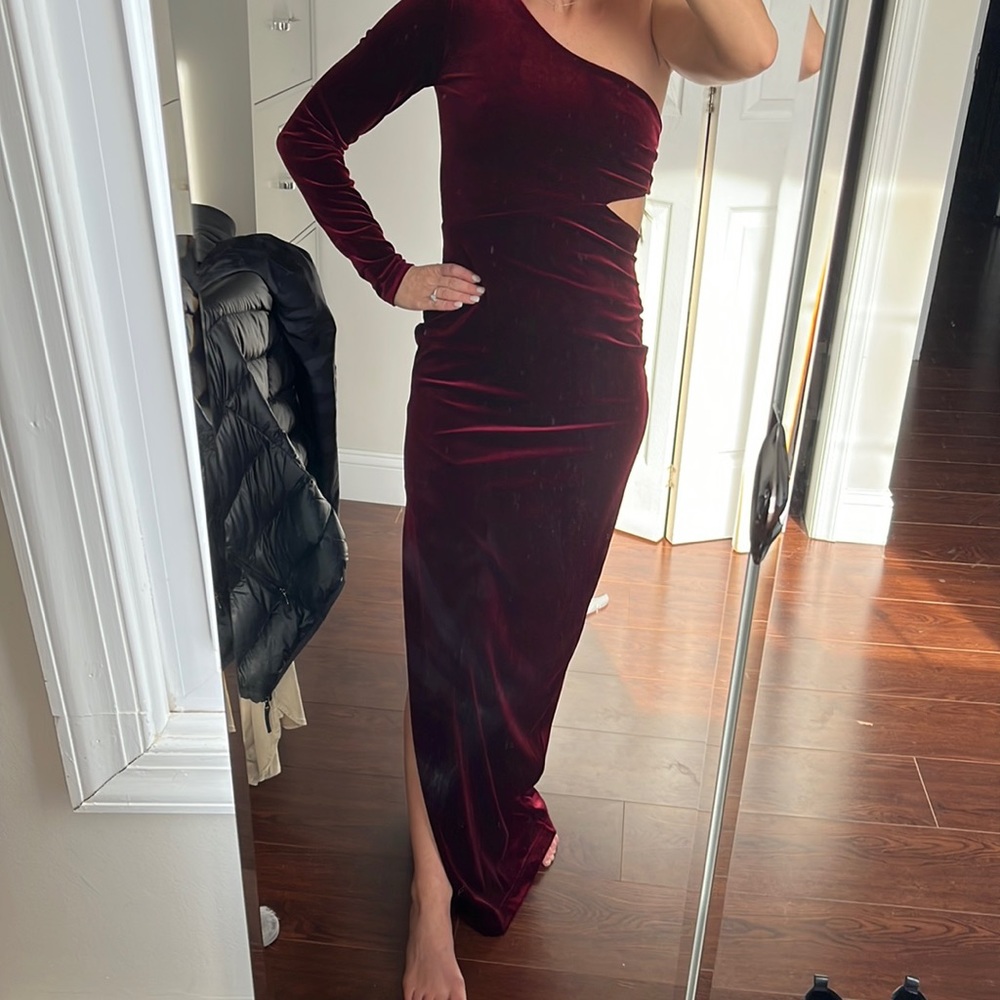 Long velvet one sleeve gown, cut outs and low back. Worn once. Dry cleaned!